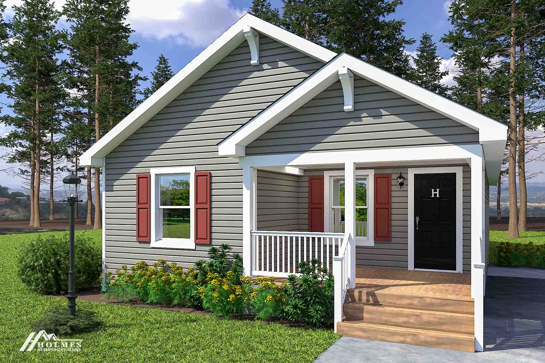 Charming small gray modular home with red shutters, white trim, a cozy front porch, and blooming flowers, surrounded by trees and grass.